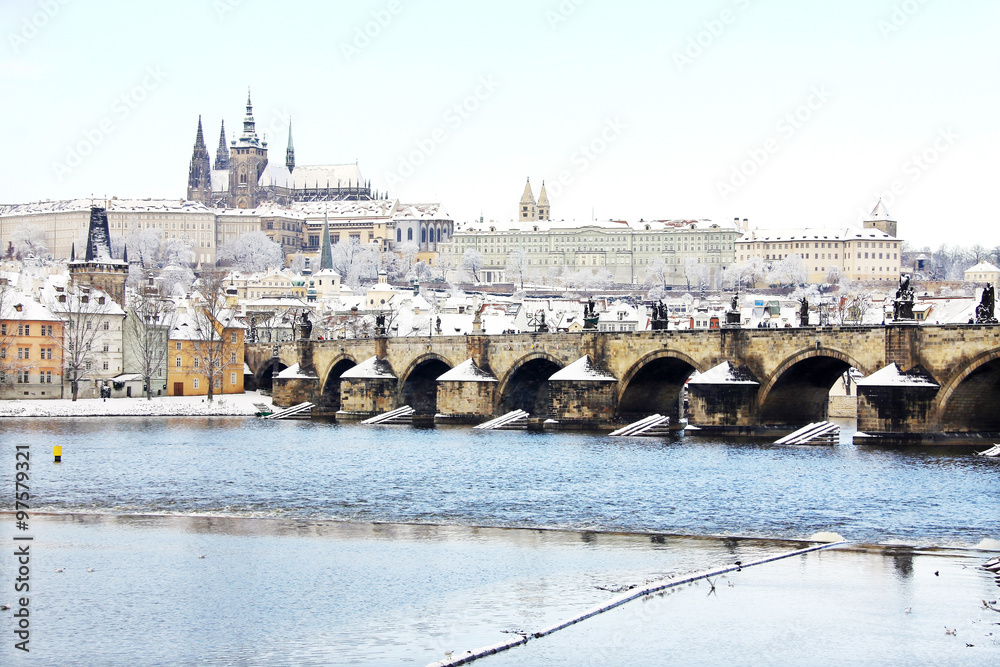 View on the snowy Prague gothic Castle with Charles Bridge, Czech Republic