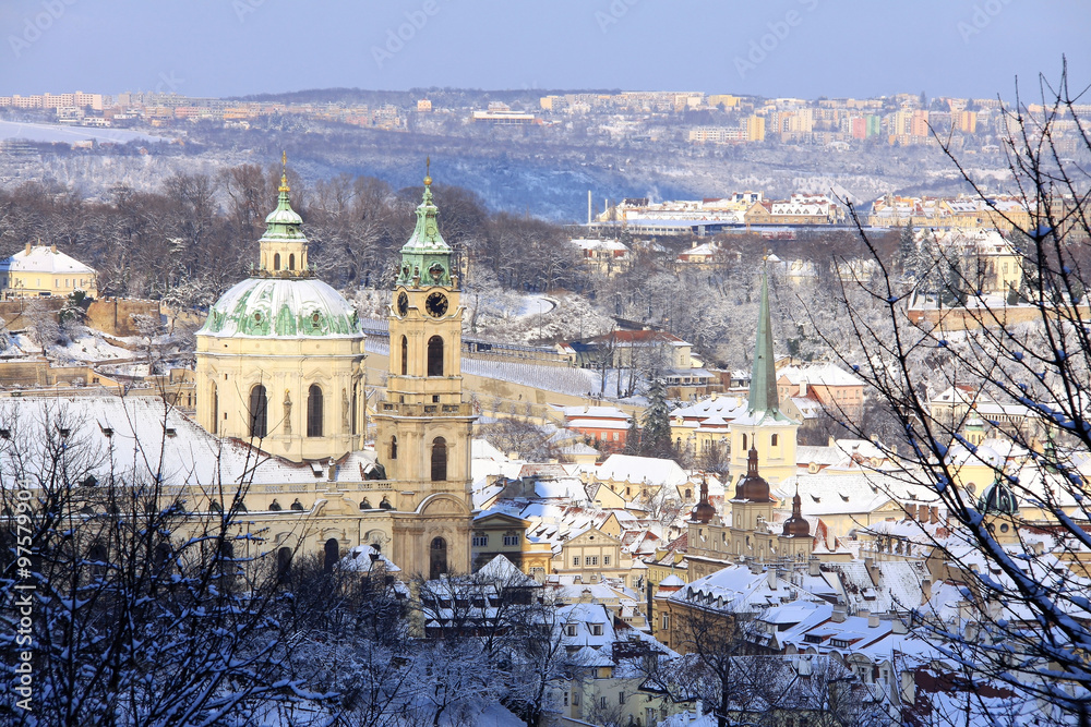 Obraz premium Christmas snowy Prague Lesser Town with St. Nicholas' Cathedral, Czech Republic