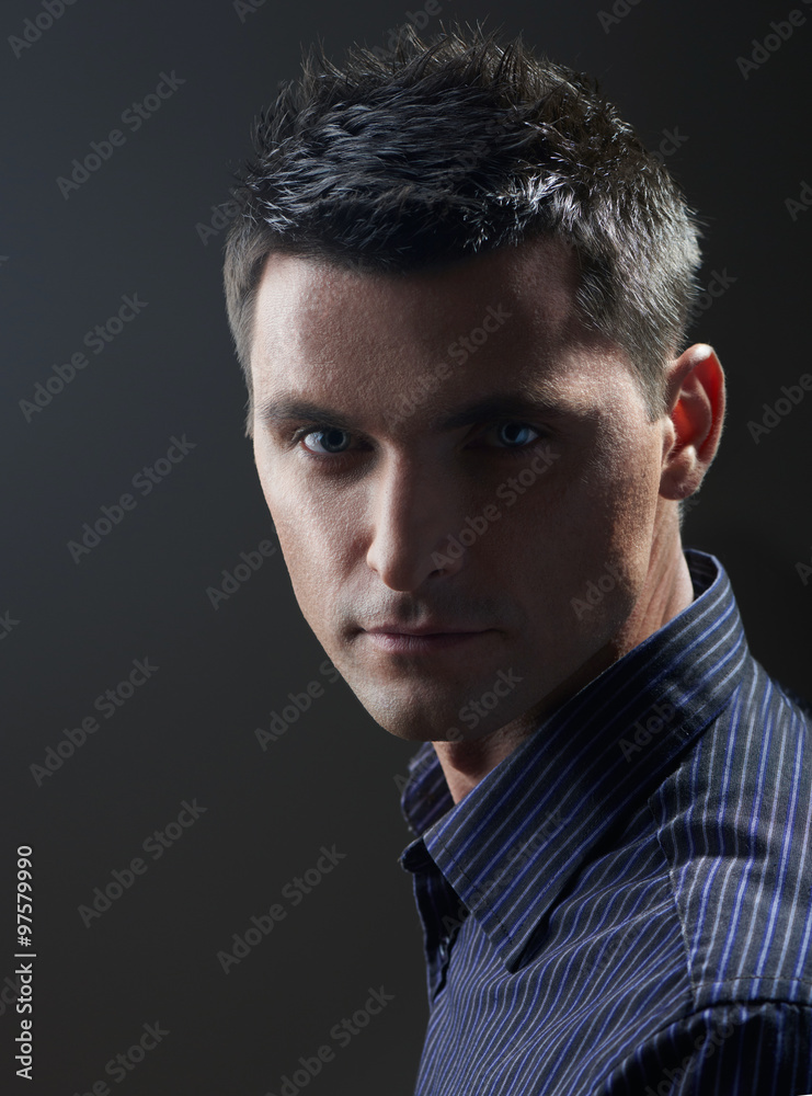 Portrait of young businessman on gray background Portrait of young businessman on gray background
