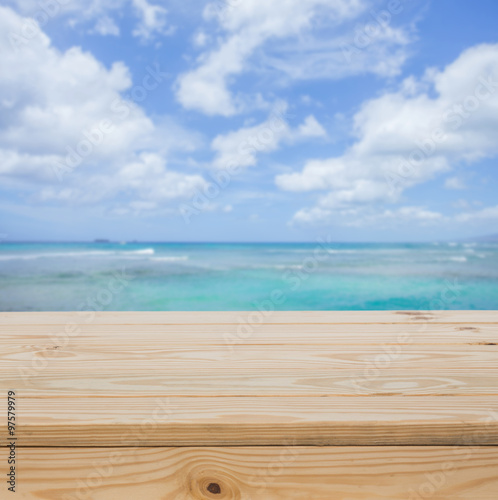 Wood table top with sea background