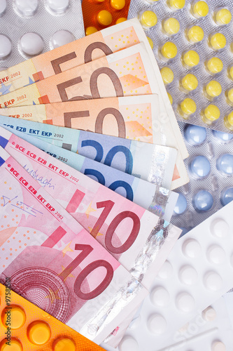 Euro money bills and colorful pills