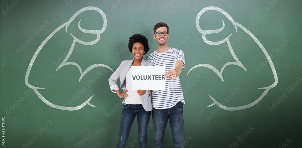 Portrait of a happy couple holding a volunteer card