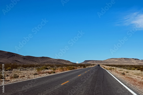 Straight highway through a desert area