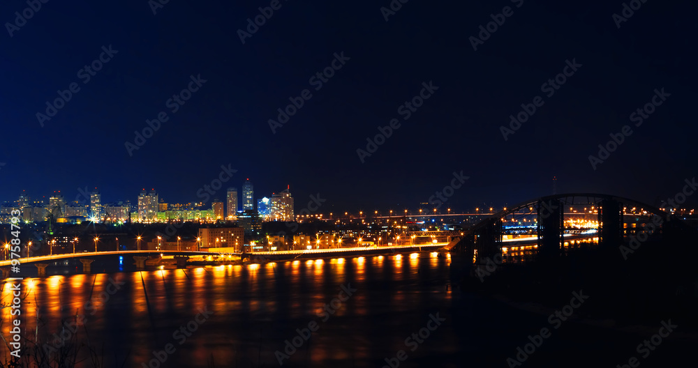 Kiev city in Ukraine at night with reflection in water