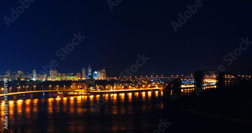 Kiev city in Ukraine at night with reflection in water