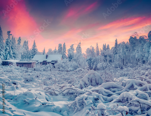 Colorful winter sunrise in the mountain village. photo