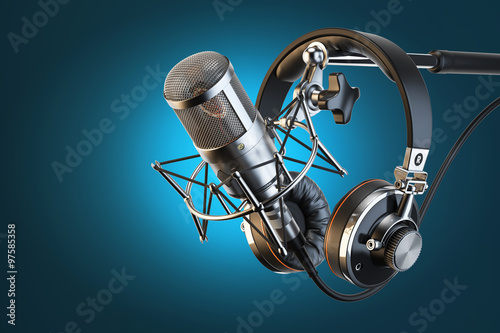 Headphones on microphone stand, professional studio photo