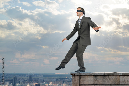 Man walking from edge of building roof