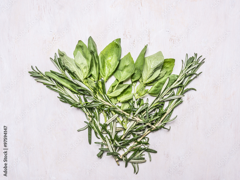 bundle of herbs, basil and rosemary on wooden rustic background top view close up bundle of herbs, basil and rosemary on wooden rustic background top view close up