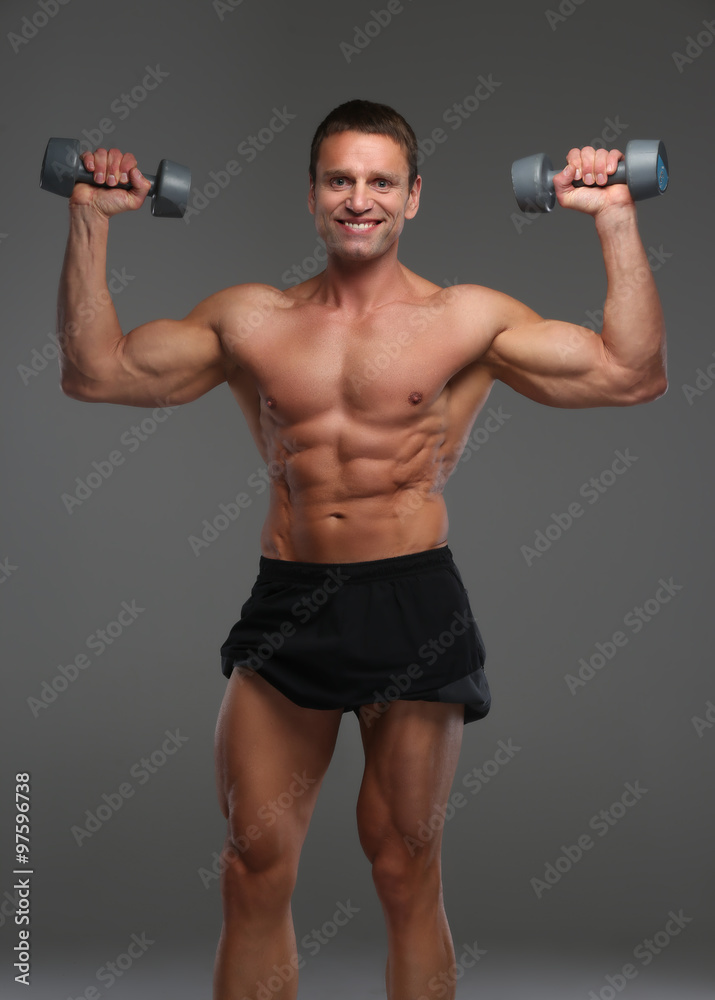 Smiling muscular guy in black shorts. Smiling muscular guy in black shorts.