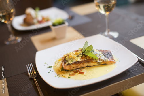 Grilled salmon with sauce a...