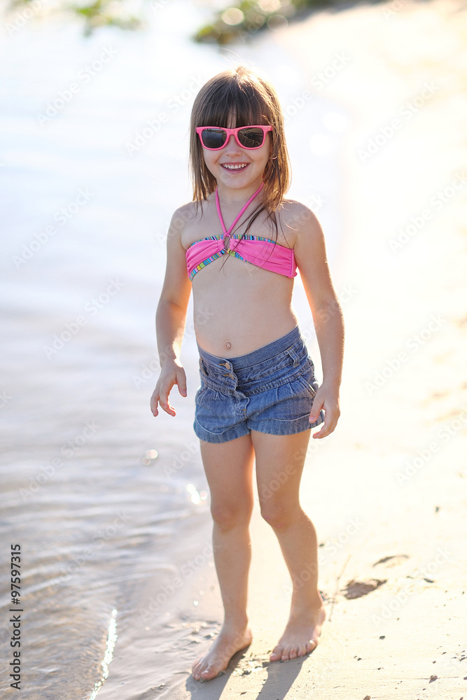 portrait of little girl outdoors in summer