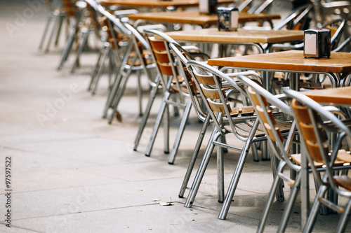 chairs in row near tables  © Grigory Bruev