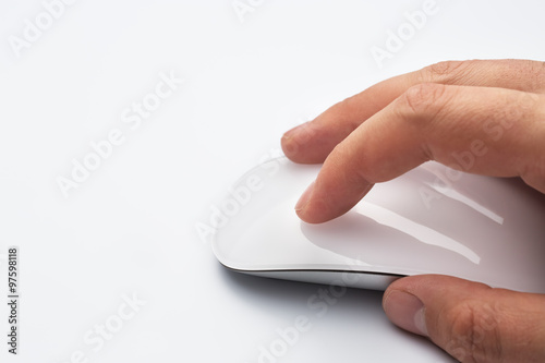 Hand holding a wireless computer mouse. photo