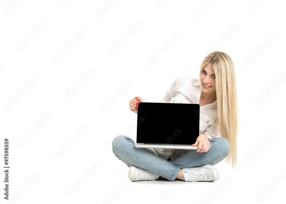 Young blonde woman showing blank laptop computer screen sitting Young blonde woman showing blank laptop computer screen sitting