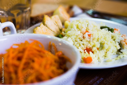 Salad of carrot and rice dish on the table photo