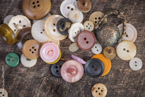 Buttons scattered on old barn wood photo