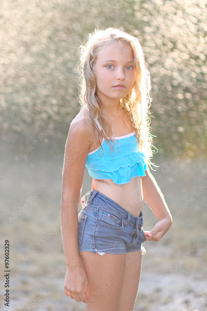 portrait of little girl outdoors in summer Stock Photo | Adobe Stock