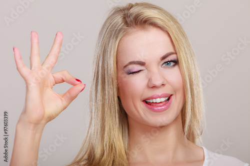 Woman showing ok hand sign gesture