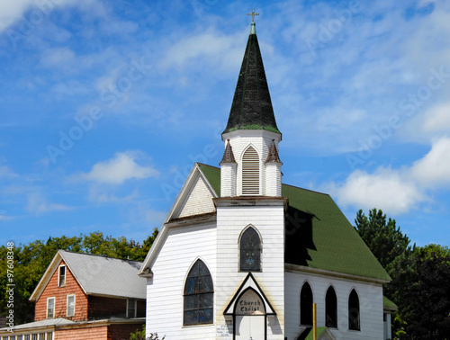 Church of Christ in Hancock, Michigan is white with green roof. Dome is also green with cross finial on steeple.