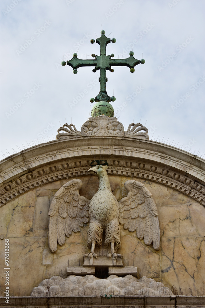Saint John Evangelist symbol with cross in Venice