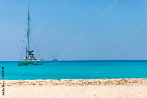 Catamaran at the beach © PhotoSerg