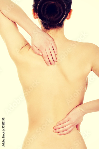 Woman with backache from behind