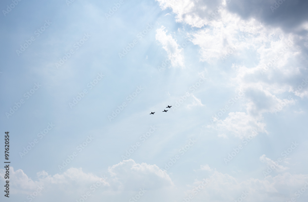 Low angle view of fighter airplanes performing airshow in sky Low angle view of fighter airplanes performing airshow in sky