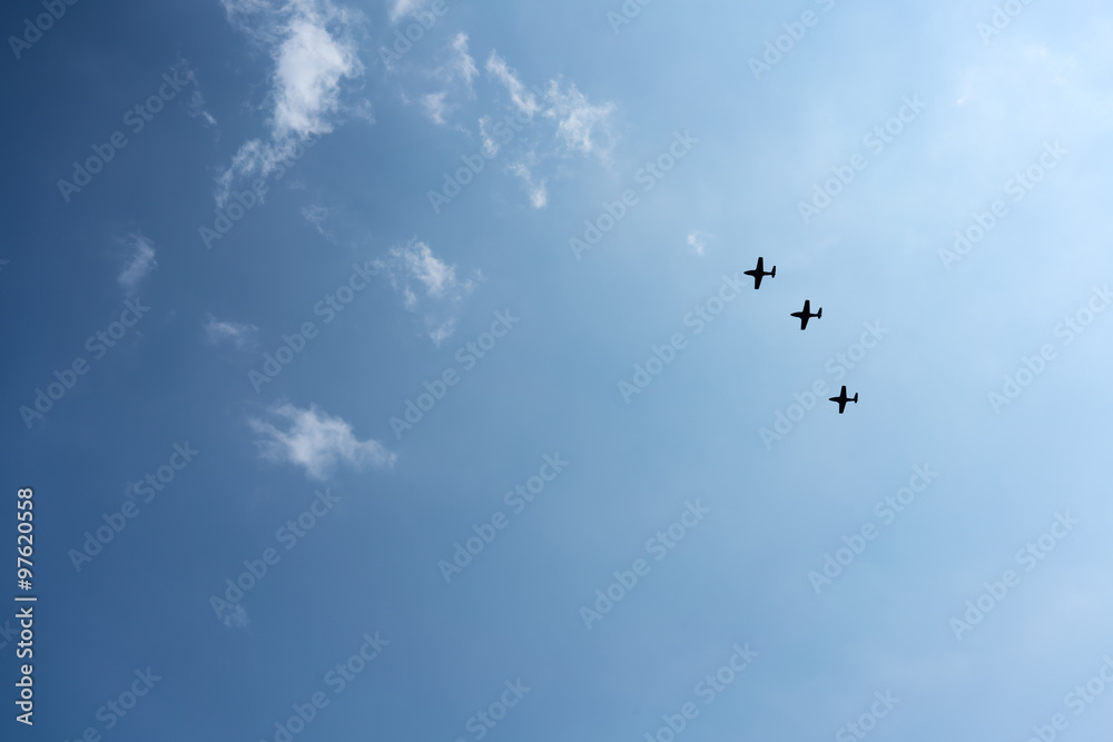 Low angle view of fighter airplanes performing airshow in sky Low angle view of fighter airplanes performing airshow in sky
