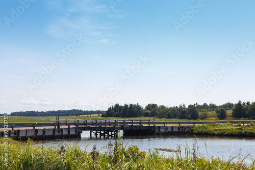 Footbridge over river against sky, Prince Edward Island, Canada © bruno135_406