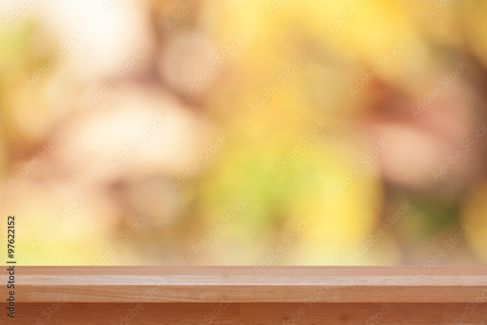 Wood table top on bokeh abstract blur background - can be used for montage or display your products Wood table top on bokeh abstract blur background - can be used for montage or display your products