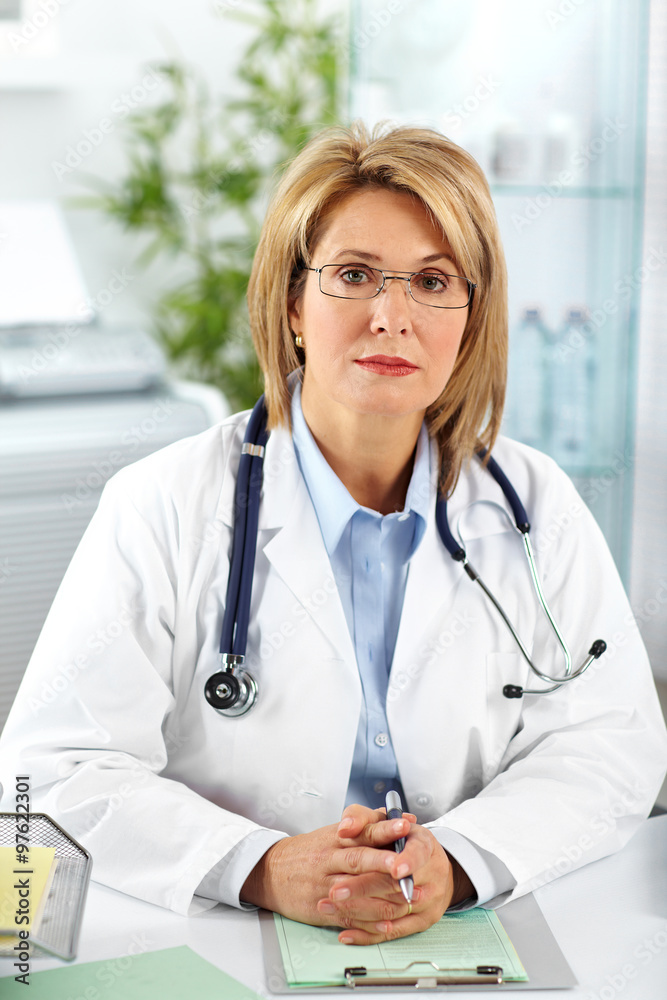 Mature doctor woman in a clinical office. Mature doctor woman in a clinical office.