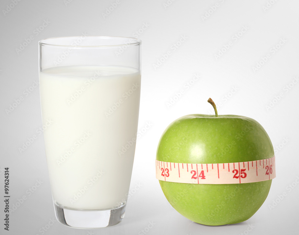 apple and milk on a white background.. apple and milk on a white background..