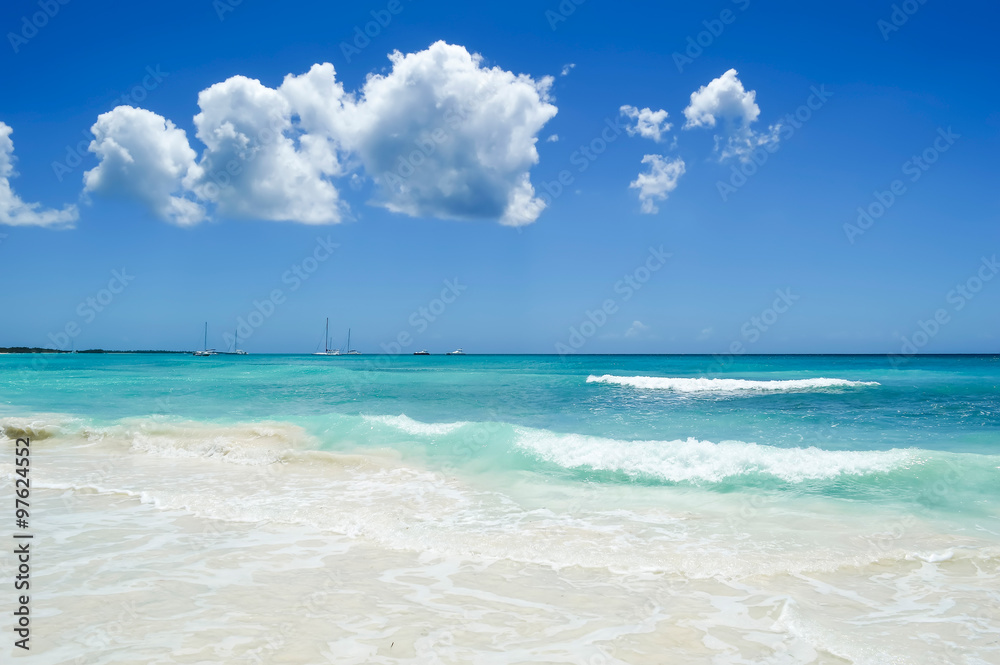 Beautiful White Sand Beach, Caribbean sea, Waves and Blue Sky