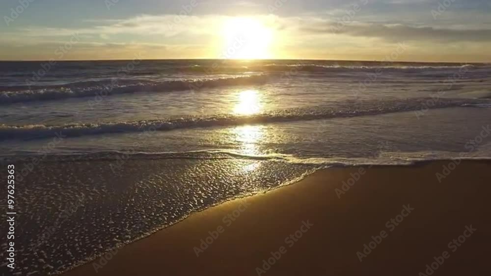 Waves gently wash up onto the beach Waves gently wash up onto the beach