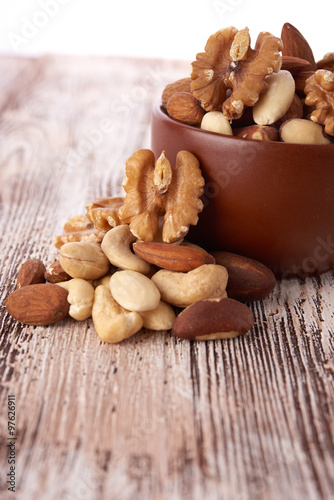 Mix nuts on wooden background