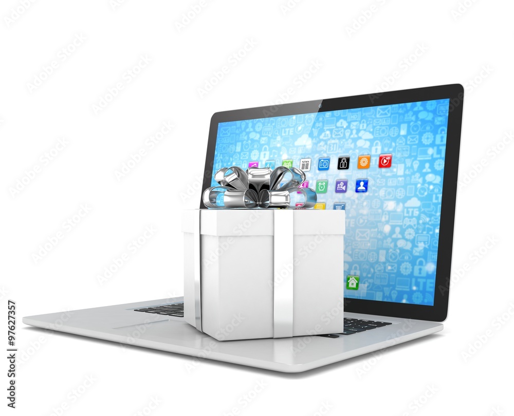 Gift box with ribbon bow on laptop keyboard Gift box with ribbon bow on laptop keyboard