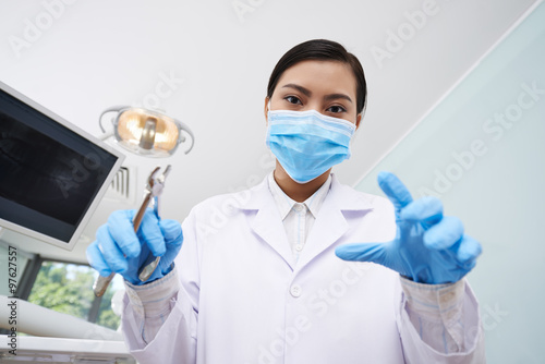 Dentist with pliers