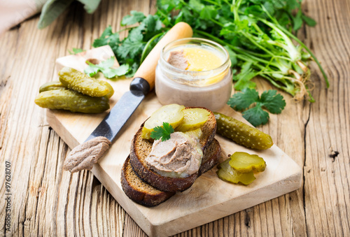 Homemade chicken liver pate on rustic wooden table