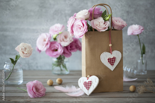 Fototapeta Naklejka Na Ścianę i Meble -  Vintage romantic backgroud with flowers and handcrafted hearts