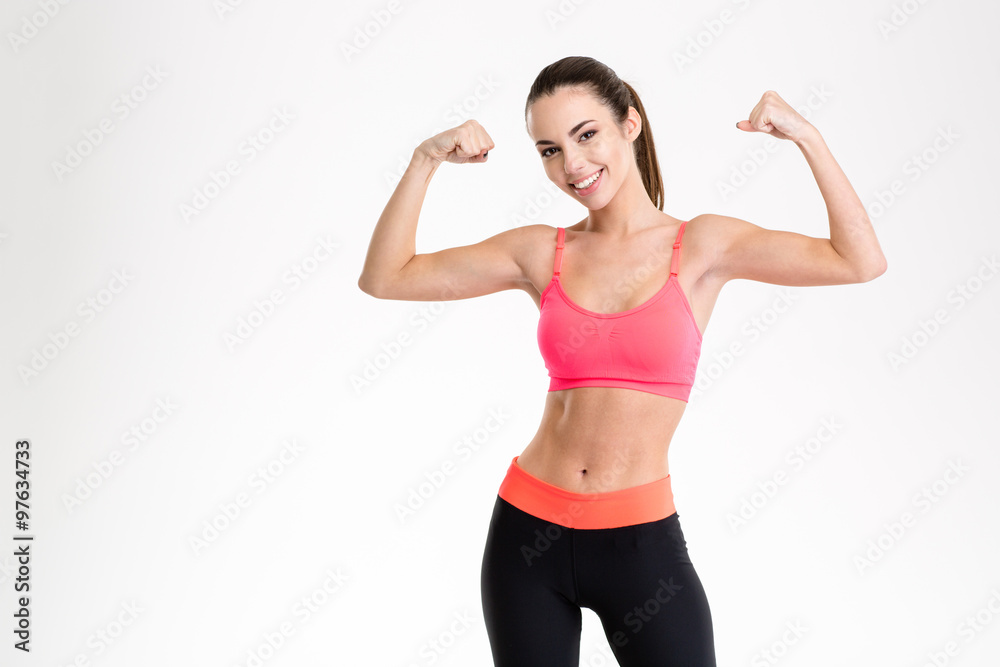 Beautiful fitness woman showing her biceps Beautiful fitness woman showing her biceps