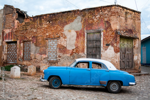 Classic vintage american car in the streets of Trinidad town, Cuba © genadijs