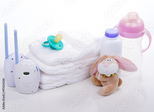 baby monitor, diapers. pacifier nipple. Toy hare banny , bottle - safety and care of the baby photo