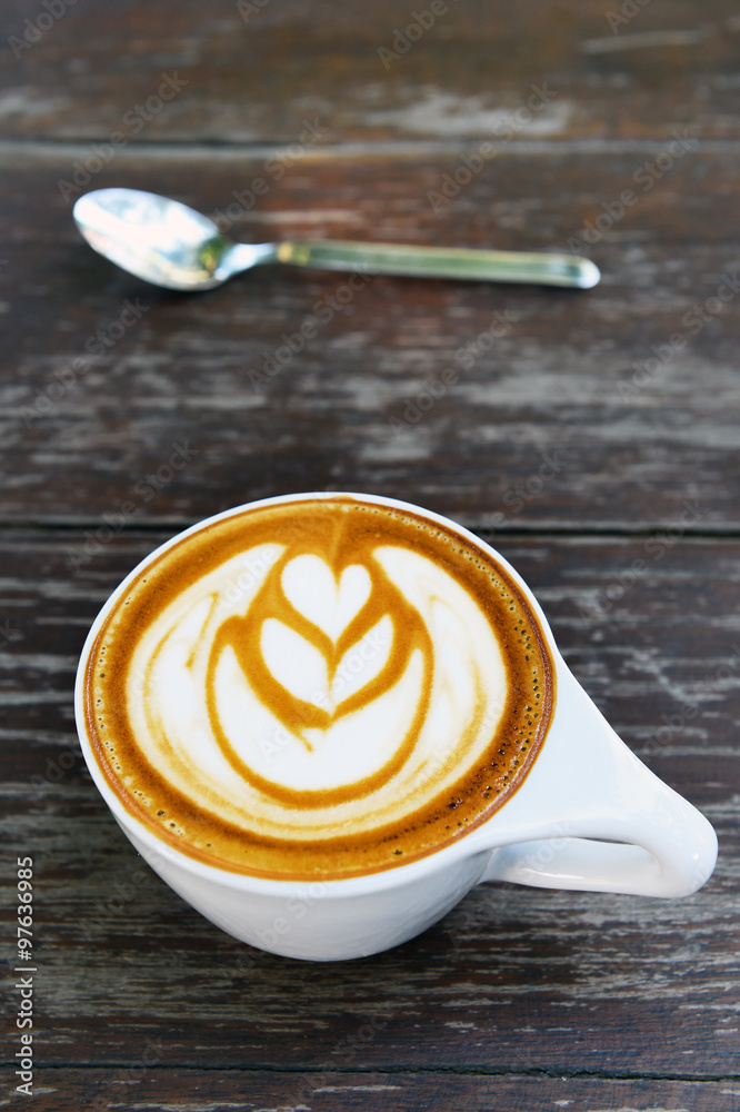 cup of latte art coffee on wooden background cup of latte art coffee on wooden background