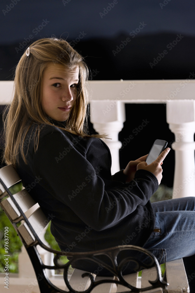 Teen chatting with the phone