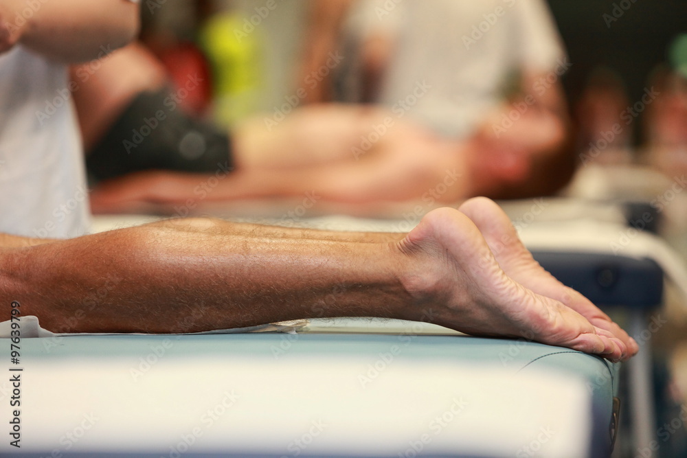 after running - waiting for massage,runner legs in focus after running - waiting for massage,runner legs in focus