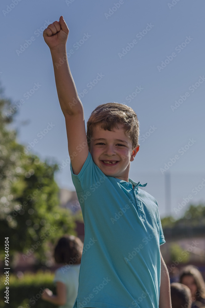 Boy raising his arm