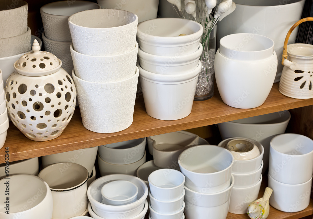 white planters in the florist shop white planters in the florist shop
