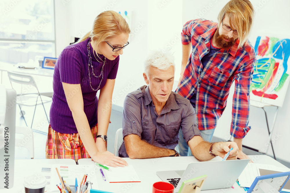 Fototapeta premium Co-workers working together