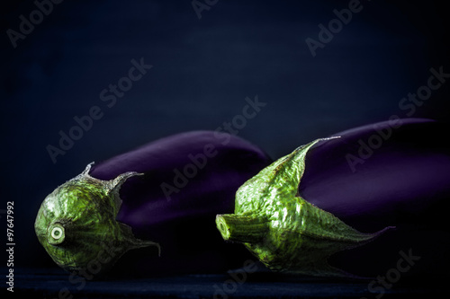 Eggplants on the dark background